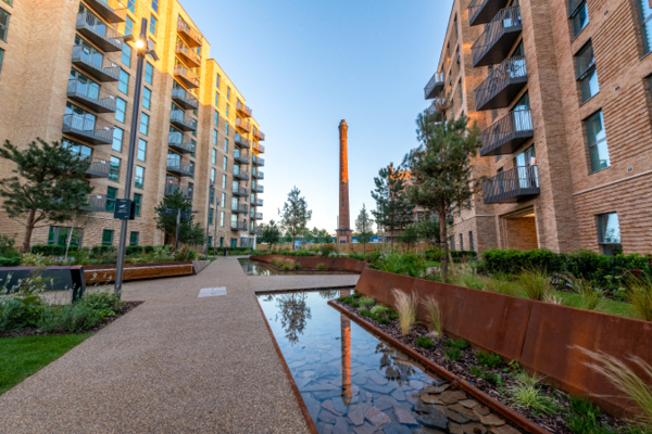 View of a completed project using Corten Weathering Steel in Horlicks Quarter Slough. Corten steel has been used as a raised planter edging,